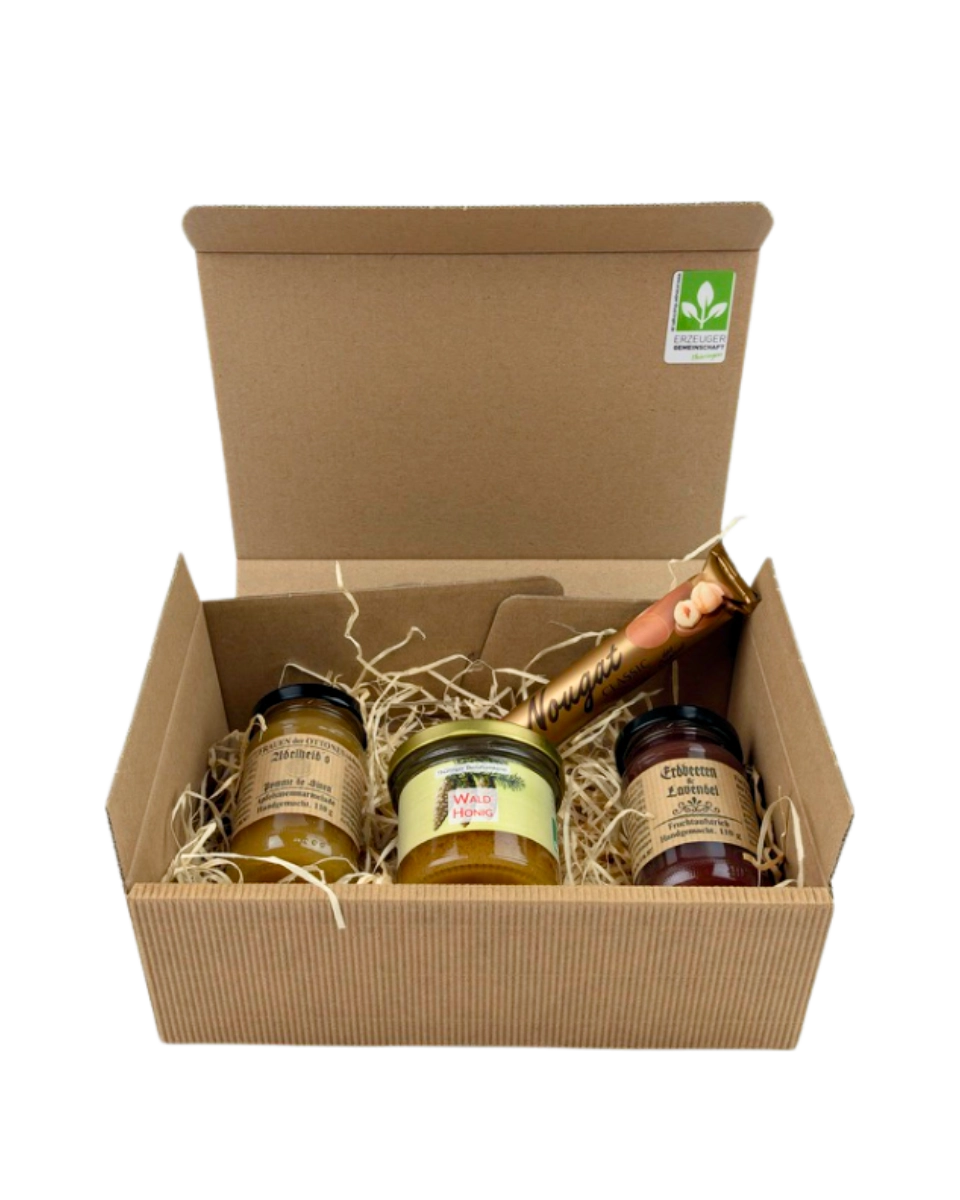 Geschenkpaket Adelheid's Pomme de Sinen Apfelsinenmarmelade, Waldhonig, Erdbeeren und Lavendel Fruchtaufstrich und Viba Classic Nougat Stange