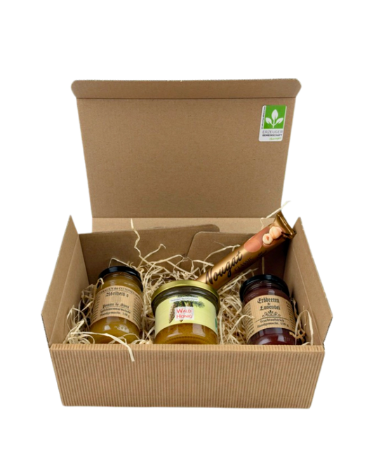 Geschenkpaket Adelheid's Pomme de Sinen Apfelsinenmarmelade, Waldhonig, Erdbeeren und Lavendel Fruchtaufstrich und Viba Classic Nougat Stange