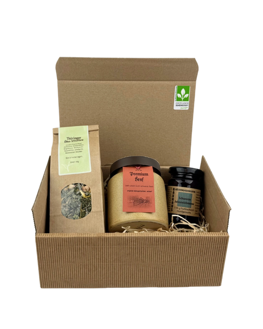 Bauhaus Geschenkpaket aus Weimar mit Fruchtaufstrich Schwarze Johannisbeere, Thüringer Premiumsenf und Öko-Vitaltee im Präsentkarton mit Holzwolle